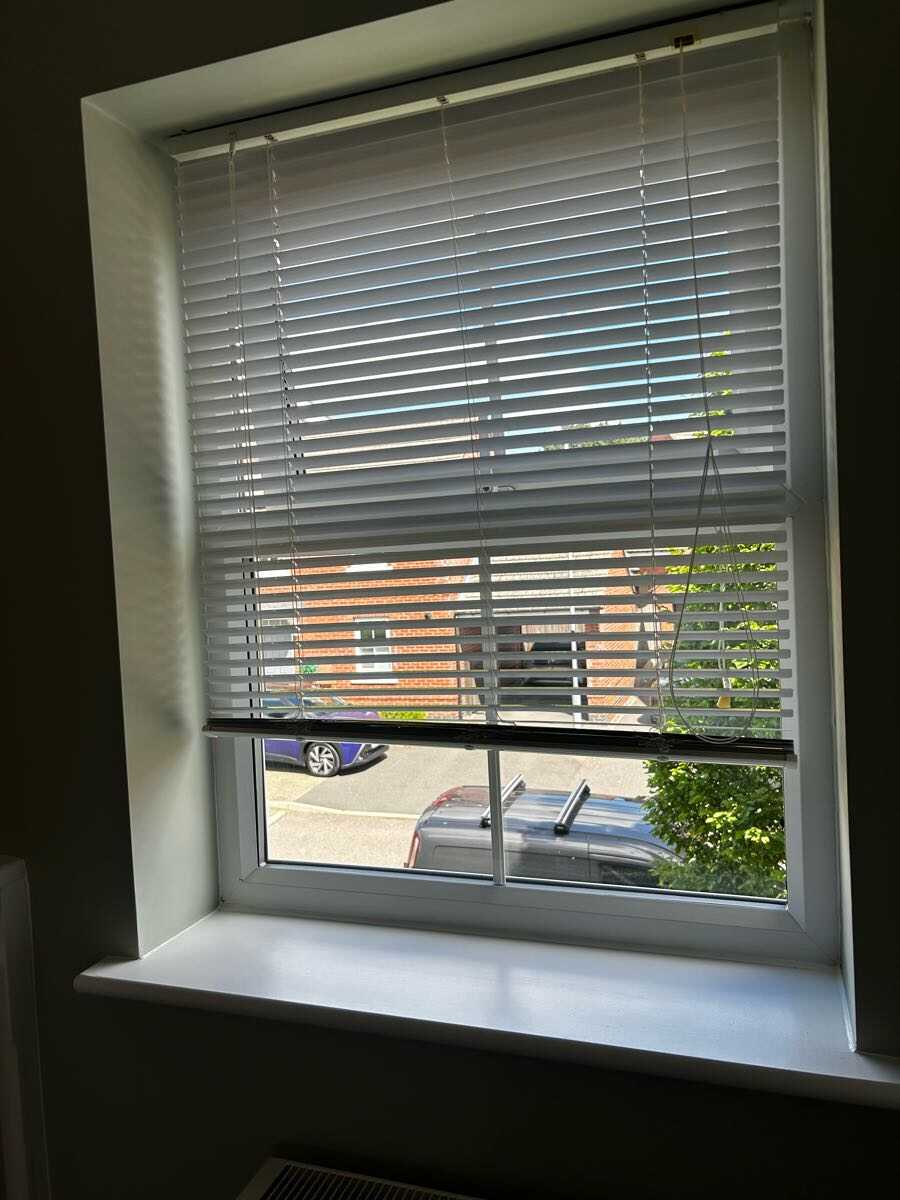 Freshly painted white window frame and sill